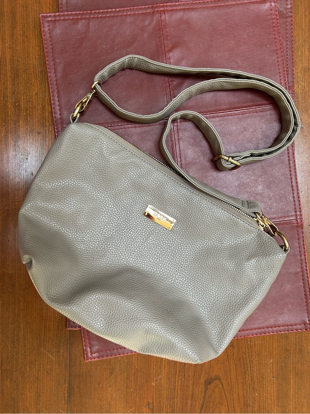 NewW/O tags BCBG/Paris Pebbled Taupe Crossbody Bag w/Gold Hardware,still covered